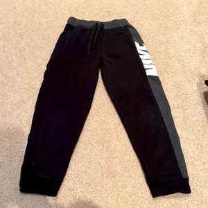 Black Nike sweatpants with side strip size 7